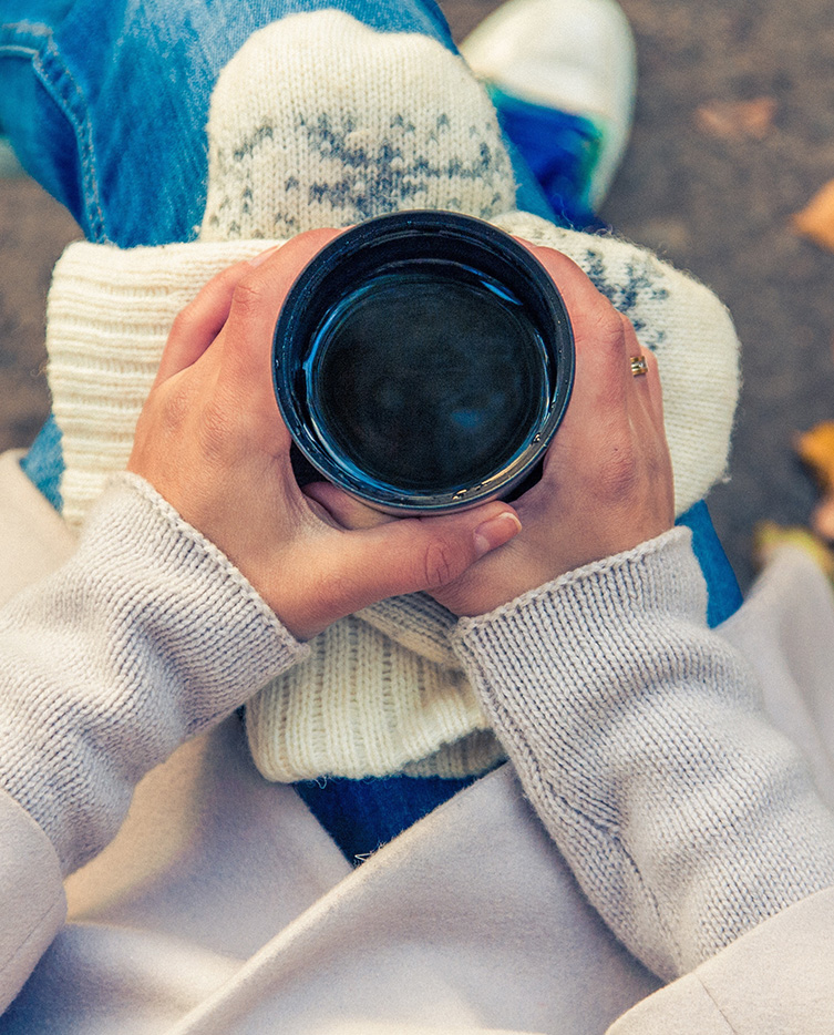 Woman Holding a Beverage