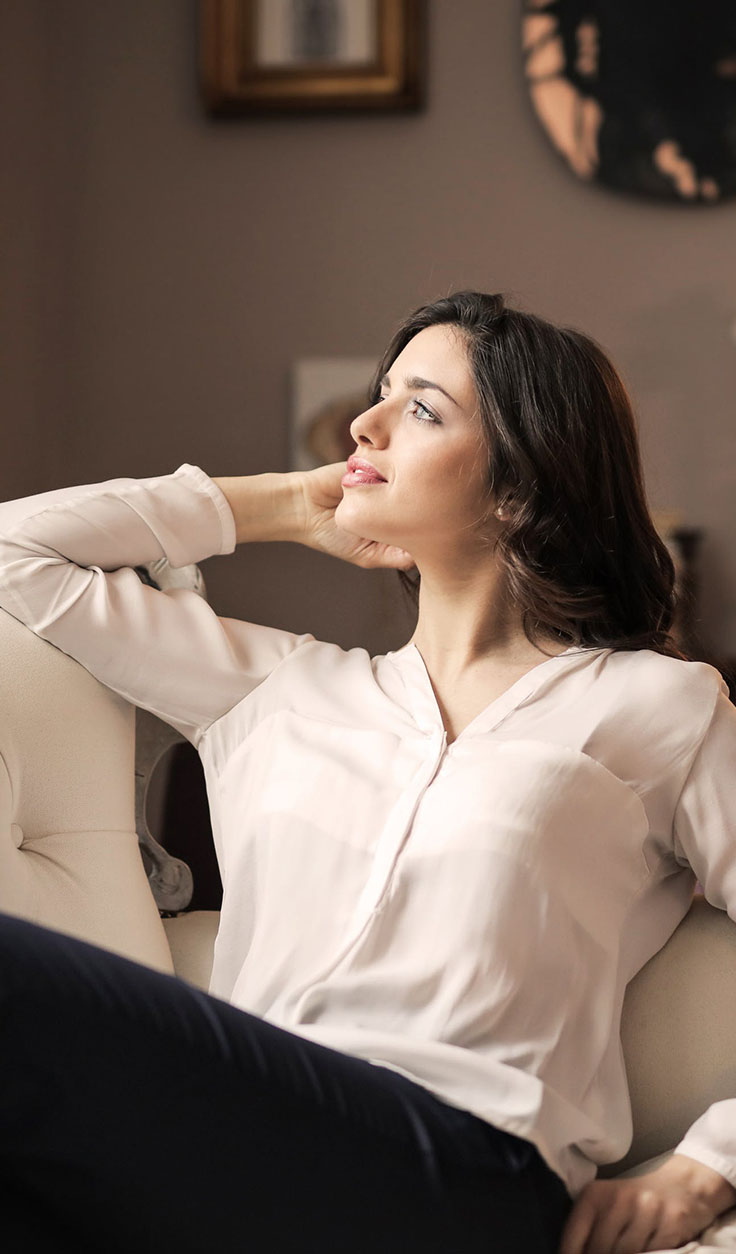 Woman Feeling Relaxed in Her Home Woman Feeling Relaxed in Her Home
