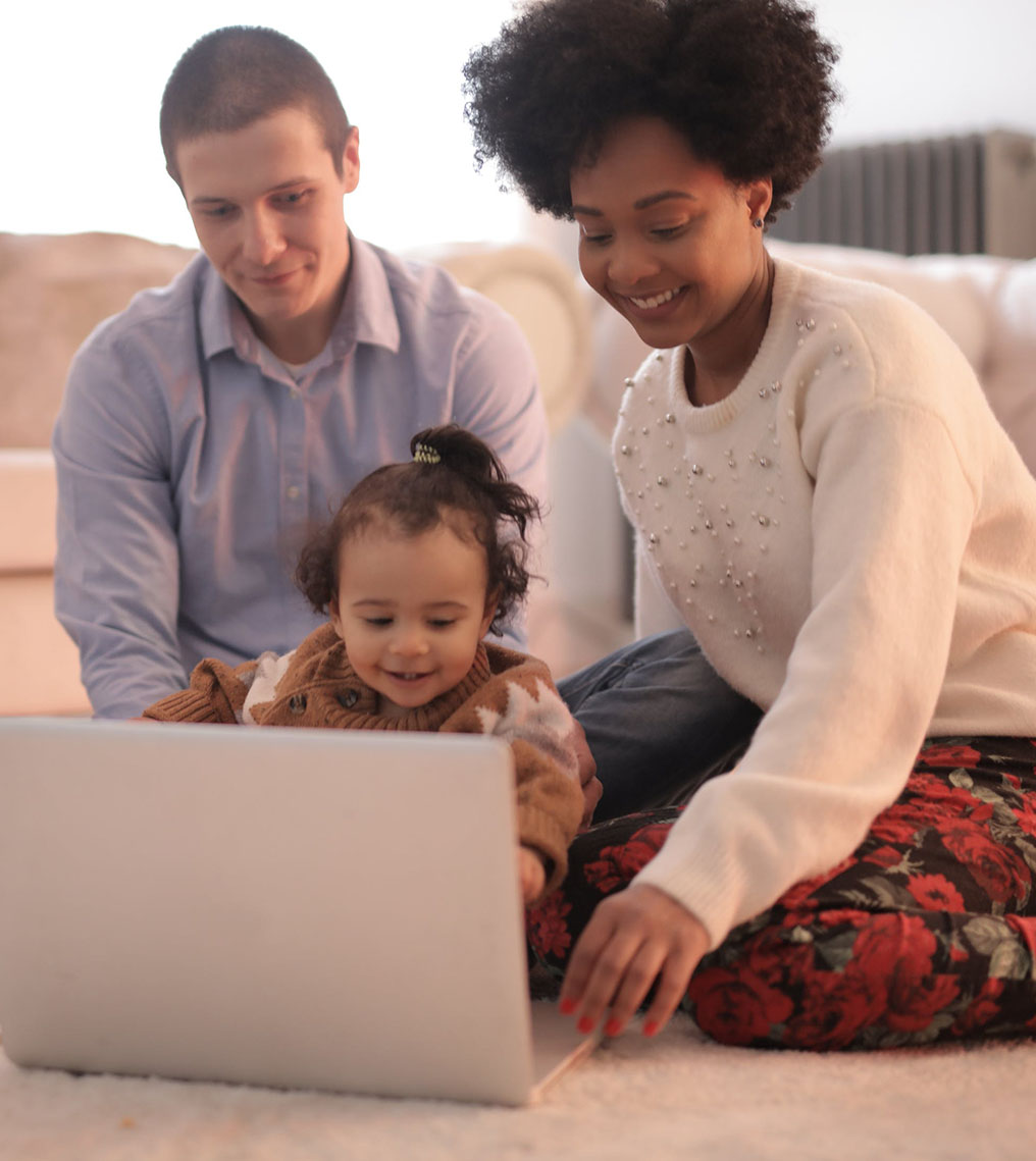 Family Watching Something on a Laptop Family Watching Something on a Laptop