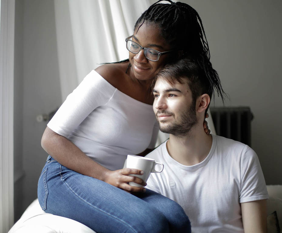 Couple Looking at the Window Feeling Relaxed Couple Looking at the Window Feeling Relaxed