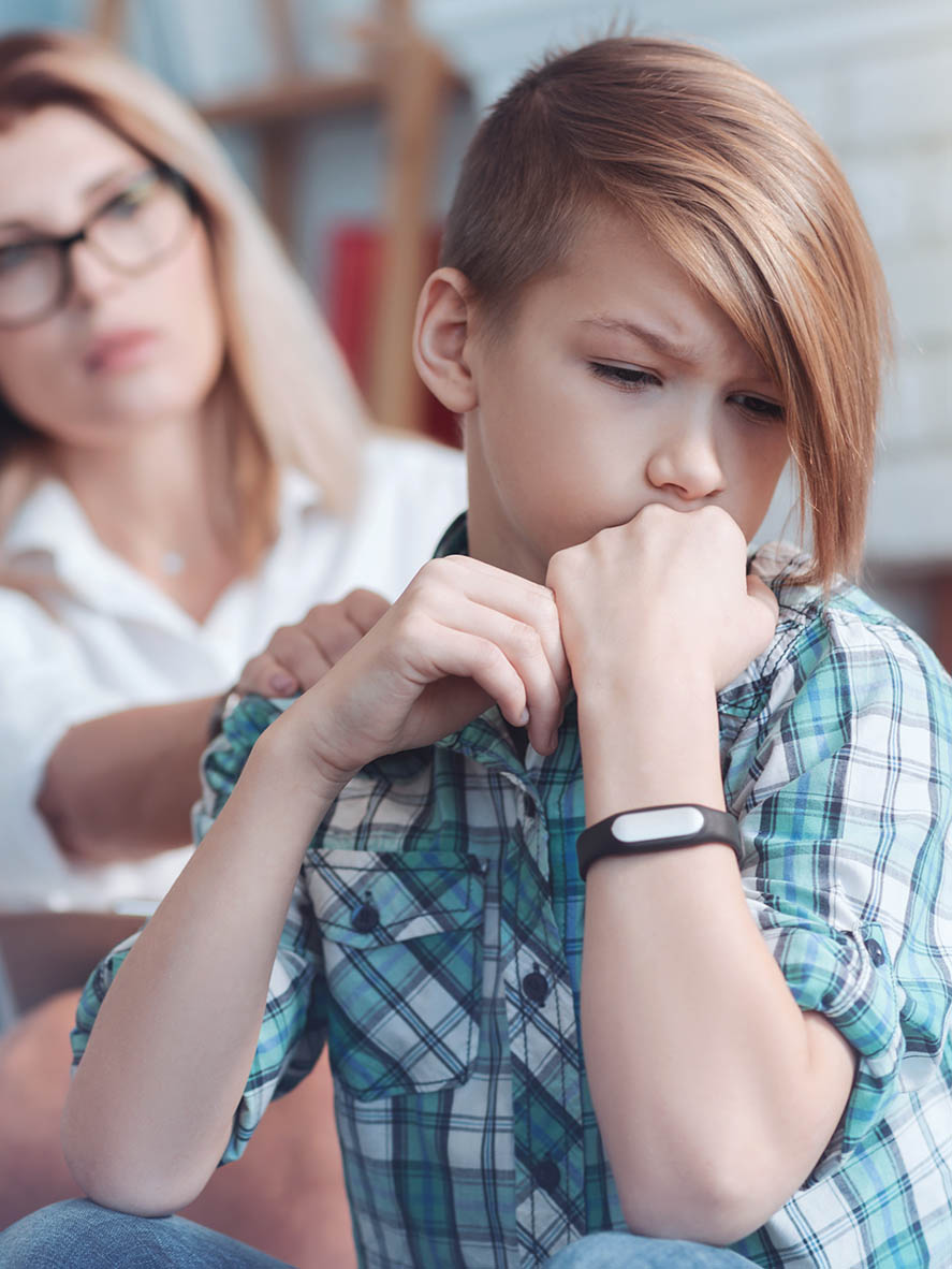 Woman Comforting a Teenage Boy