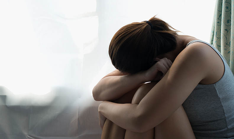 Woman Feeling Frighten Near the Window Woman Feeling Frighten Near the Window
